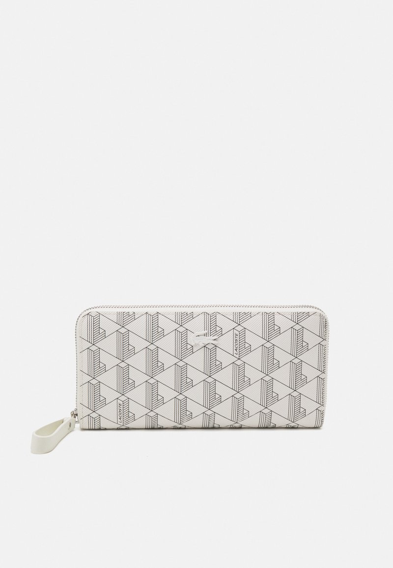 White wallet with geometric black pattern, zip closure, and a logo tag. Features a textured surface and a side loop for easy carrying.
