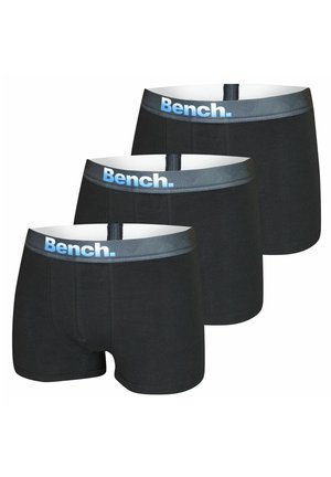 Schwarze Boxershorts mit einem weichen, elastischen Bund. Der Bund trägt den Aufdruck "Bench." in Blau. Es werden drei Paare präsentiert.