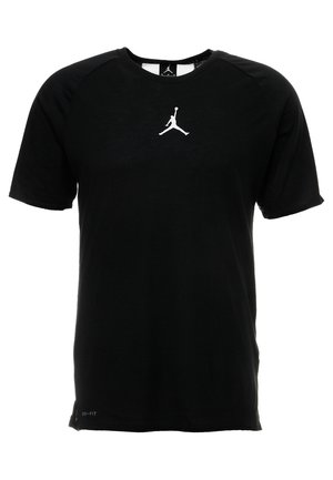 Czarna sportowa koszulka z krótkim rękawem z białym logo Jumpman na środku klatki piersiowej i małym napisem „Dri-FIT” blisko dolnego brzegu.