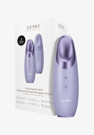 Appareil énergisant pour les yeux violet chaud et froid avec tête de traitement incurvée, affichant les boutons soleil et flocon de neige, à côté de son emballage blanc marqué.