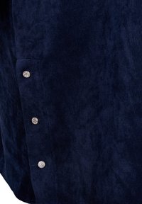 Tissu en velours côtelé bleu marine avec des nervures verticales, doté de cinq boutons-pression métalliques le long du côté et d'une texture lisse.