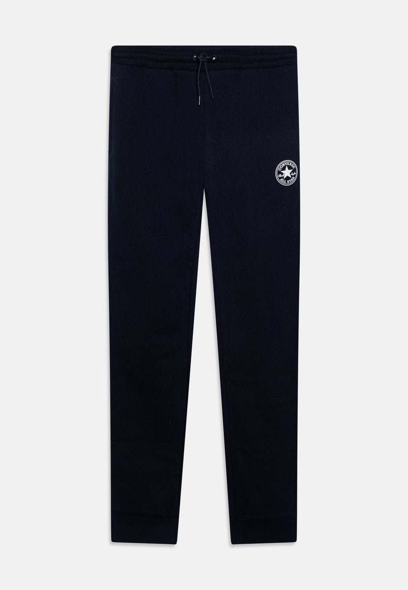 Marineblå joggebukser med elastisk midje, snor og en liten hvit logo på låret. Myk, glatt stoff, tapered passform ved anklene.