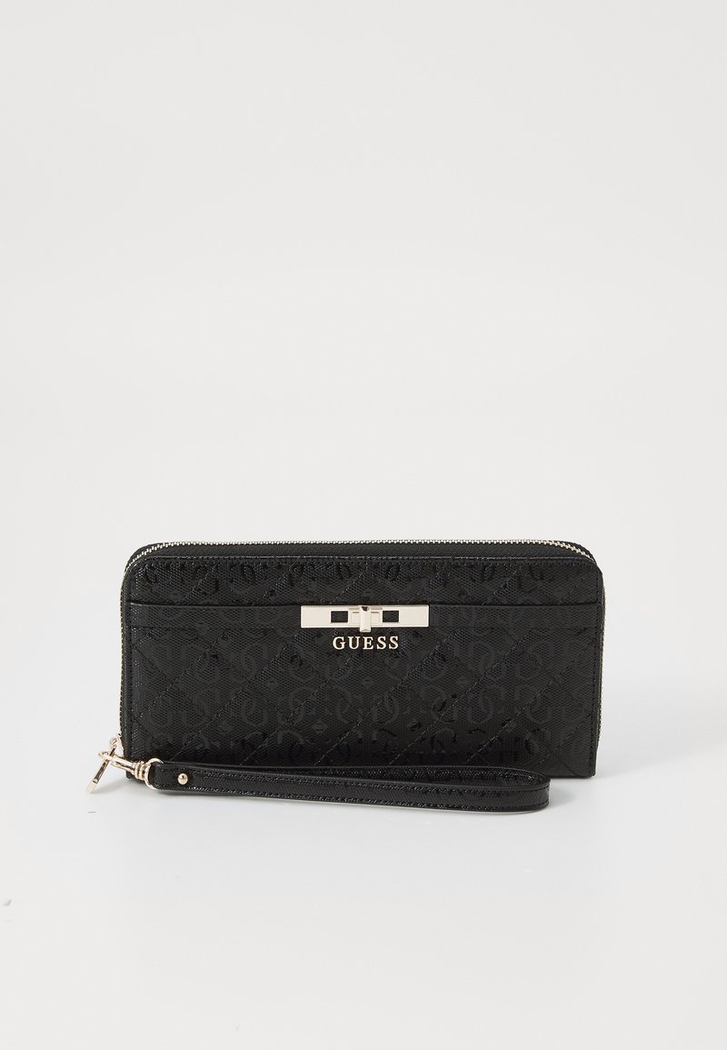 Black wallet with a textured pattern, featuring a gold tone hardware clasp and wrist strap. Zipper closure along the top.