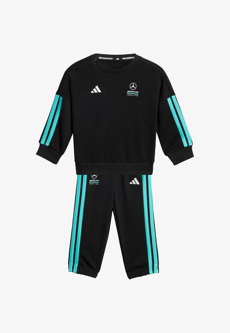 Completo sportivo nero composto da top a maniche lunghe e pantaloni. Caratteristiche strisce turchesi lungo le maniche e i lati dei pantaloni, logo adidas su entrambi i capi.