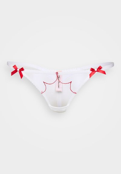 Valge pitsist stringeid punase broderi ja paelte aktsentidega. Omab sildiga brändinime. Sile kangas ja lainelised servad.