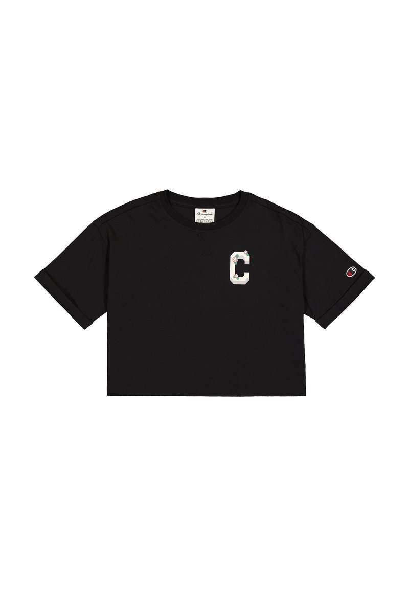 Maglietta nera corta in cotone con logo "C" bianco e dettagli floreali, e un piccolo logo Champion sulla manica.