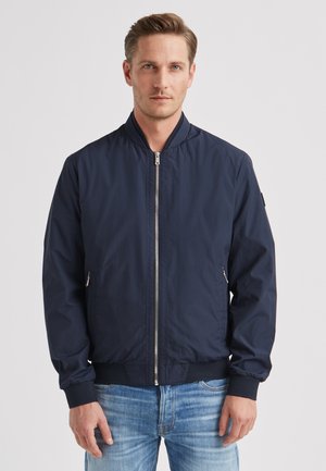 Marineblaue Bomberjacke aus leichtem Stoff, mit einem Frontreißverschluss, zwei Seitentaschen, gerippten Bündchen und einem Rundhalsausschnitt.