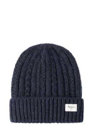 Navy knitted beanie hat with ribbed cuff. Made of textured wool with a cable knit pattern. Features a small branded label on the cuff.