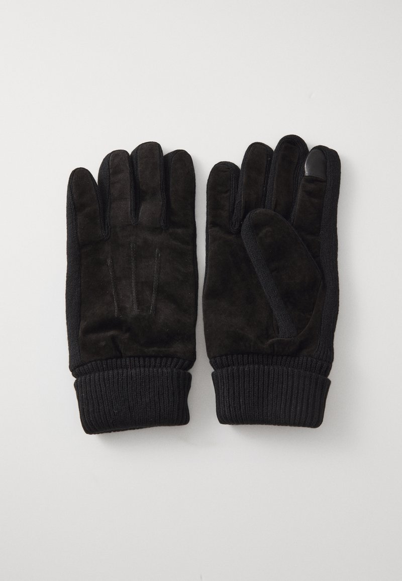 Schwarze Handschuhe aus Wildleder mit gerippten Strickbündchen, die eine glatte Textur aufweisen und über drei dekorative Nähte auf den Handflächen verfügen.