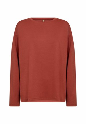 Long-sleeve top in brick red, made of soft fabric, features a round neckline and relaxed fit with dropped shoulders and minimal stitching details.