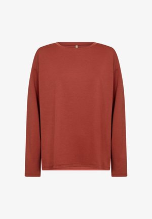 Ilgų rankovių marškinėliai plytų raudonos spalvos, pagaminti iš minkštos medžiagos, turi apvalų iškirpimą ir laisvą sijoną su nuleistomis pečių siūlėmis ir minimaliais siuvinėjimo akcentais.