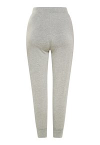 Grå, bomulds joggers med en tætsiddende pasform, elastisk talje og ribbede manchetter ved anklerne. Glat tekstur med minimale syninger.