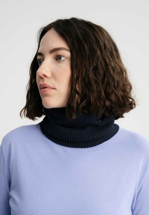 Light purple top with a dark blue ribbed turtleneck. Features a smooth texture and close-fitting design. Cropped view focusing on neck.