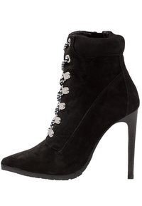 Black suede ankle boot with a pointed toe, silver hardware, and multi-colored laces. Features a high stiletto heel and textured surface.