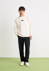 Ellesse MACCHIE - Tréningruha alsók - black