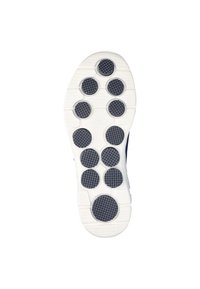 Suela de zapato con una base blanca, con agarres de goma negra en forma circular y acentos texturizados para tracción. Ligera, diseñada para la comodidad.