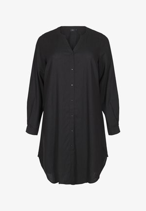 Juodas ilgų rankovių marškinėlis su V formos iškirpte, mygtukų uždarymu ir šiek tiek įlenkta apačia. Pagamintas iš lengvos medžiagos su matinio paviršiaus tekstūra.