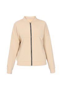 Beige bomber dzseki puha anyagból, fekete cipzáras elülső résszel, állógallérral és lejjebb eső vállakkal a laza illeszkedésért.