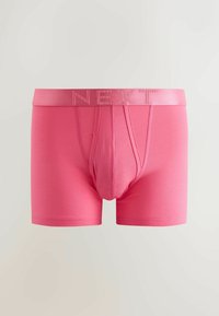 Boxeri roz pentru bărbați, cu o talie elastică lată pe care este inscripționat numele brandului „NEXT” în aceeași nuanță.