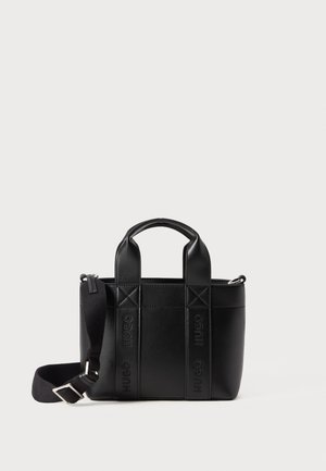 Black leather handbag with dual top handles, detachable strap, and embossed branding. Features a structured design with a zip closure.