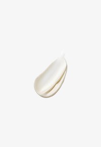 Krämig lotion med en jämn, off-white textur, något glansig med subtila ränder; ser tjock och rik ut, liknande en klick.
