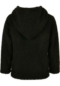 Schwarze, gefütterte Fleecejacke mit strukturierter, plüschiger Oberfläche. Mit langen Ärmeln und einer lockeren Passform, die für Komfort und Wärme sorgt.