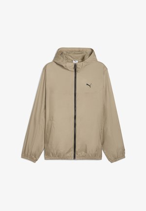 Beige letvægtsjakke med hætte, sort lynlås og Puma-logo. Har elastiske manchetter og sidelommer. Glat tekstur, afslappet design.