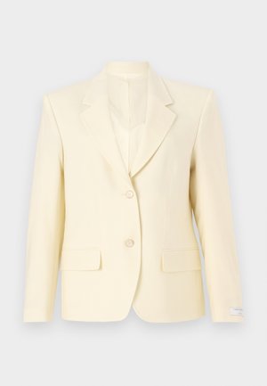 Light yellow tailored blazer with a notch collar, single-button closure, two front pockets, and smooth fabric texture.