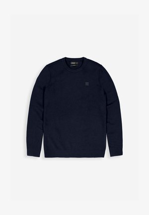 Marineblauwe sweatshirt met ronde hals, gemaakt van zachte stof, met lange mouwen en geribbelde manchetten, en een subtiele logopatch op de borst.