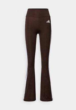 Brown flared athletic leggings with a high waistband, featuring white side stripes and a white logo on the front left thigh. Smooth texture.
