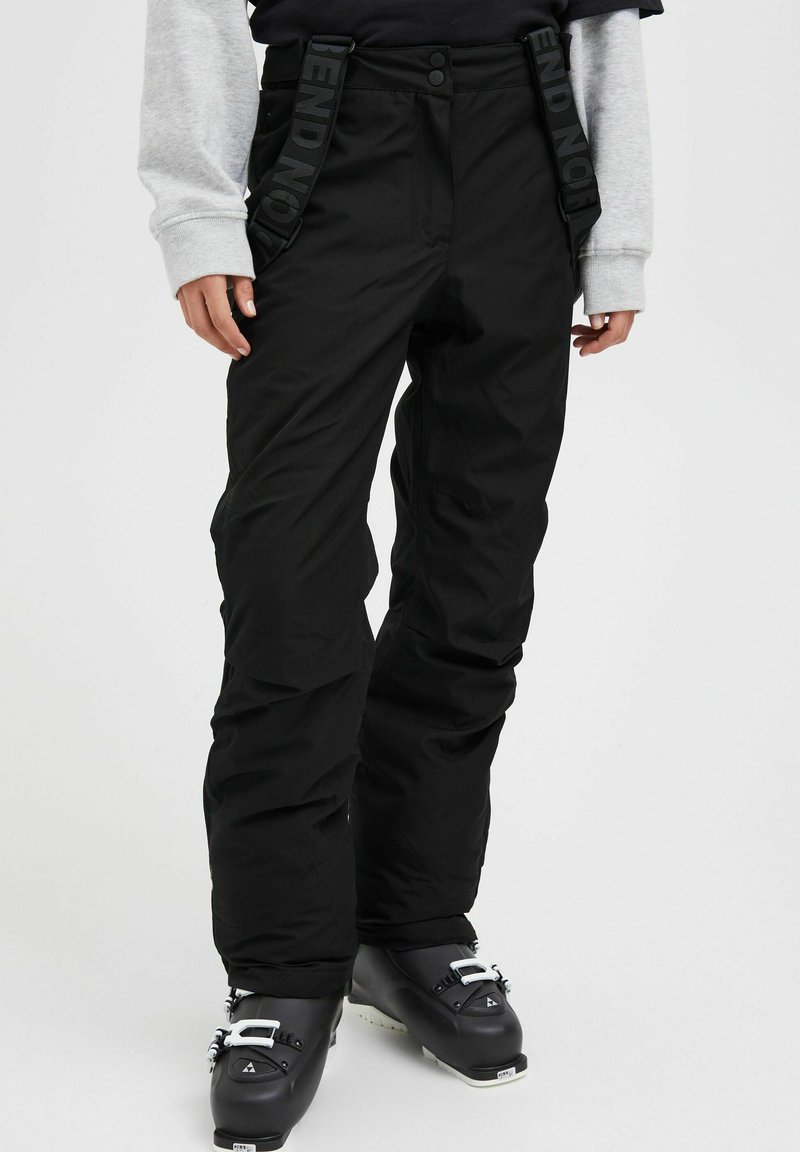 Black snow pants with adjustable straps featuring "BEND NOT" printed. Made from waterproof material, designed with a relaxed fit and reinforced knees.