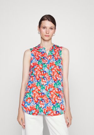 Camisola sem mangas floral em vermelho, azul, verde e branco, apresentando um colarinhohalter e fecho de botão à frente com um corte solto e tecido suave.