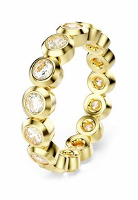 Bague en or présentant plusieurs sertissages circulaires avec des pierres précieuses claires et de couleur champagne, affichant une surface lisse et polie ainsi qu'un design homogène.