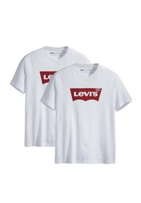 Tohvide Levi's t-shirts med korte ærmer og det røde Levi's-logo centreret på brystet, vist mod en hvid baggrund.