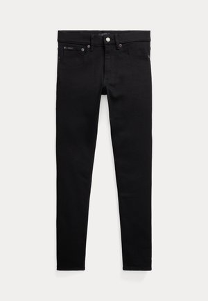 Jeans en denim noir avec une coupe slim, un design à cinq poches, fermeture à bouton en métal, et des détails de couture subtils sur les poches et les coutures.