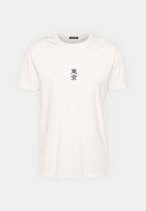 Katoenen T-shirt in gebroken wit, met korte mouwen en een ronde hals. De voorkant toont blauwe Japanse karakters. Zachte textuur, casual ontwerp.