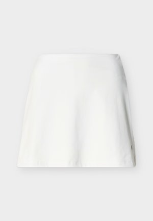 Vienkārša balta A līnijas svārki ar gludu tekstūru un smalku šuvju detaļu netālu no apakšmala, attēloti uz gaiši pelēka fona.