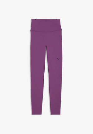 Leggings violet taille haute sans coutures avec un petit logo Puma noir sur la cuisse gauche, étalés à plat sur un fond blanc.