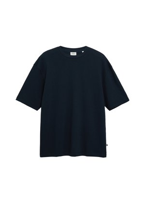 T-shirt noir texturé à manches courtes et col rond, coupe décontractée, avec une petite étiquette en tissu sur la couture latérale inférieure.