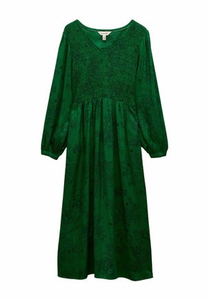 Grøn, langærmet kjole med smocket bol og en blød skørt. Blomsterprint i mørkere grønne nuancer, V-udskæring og elastiske manchetter.
