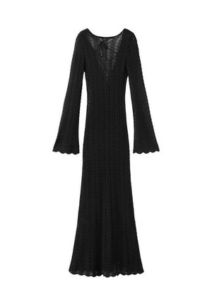 Vestido negro de punto con mangas largas, bordes ondulados, mangas acampanadas y escote en V profundo atado con un pequeño lazo en la parte posterior.