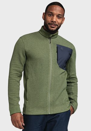 Green fleece jacket with textured fabric, high collar, and a navy zippered chest pocket. Features a full front zipper and fitted design.