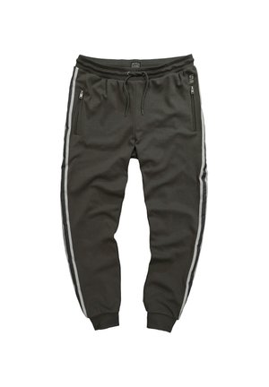 Dunkelolivgrüne Jogginghose aus weichem Stoff, mit seitlichen Reißverschlusstaschen und grauen Seitenstreifen. Elastischer Bund mit verstellbarem Kordelzug.