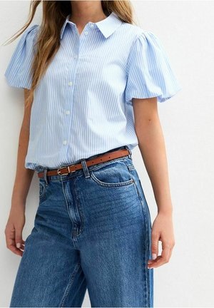 Light blue vertical striped short puff sleeve button-up shirt paired with high-waisted blue jeans and a brown belt.