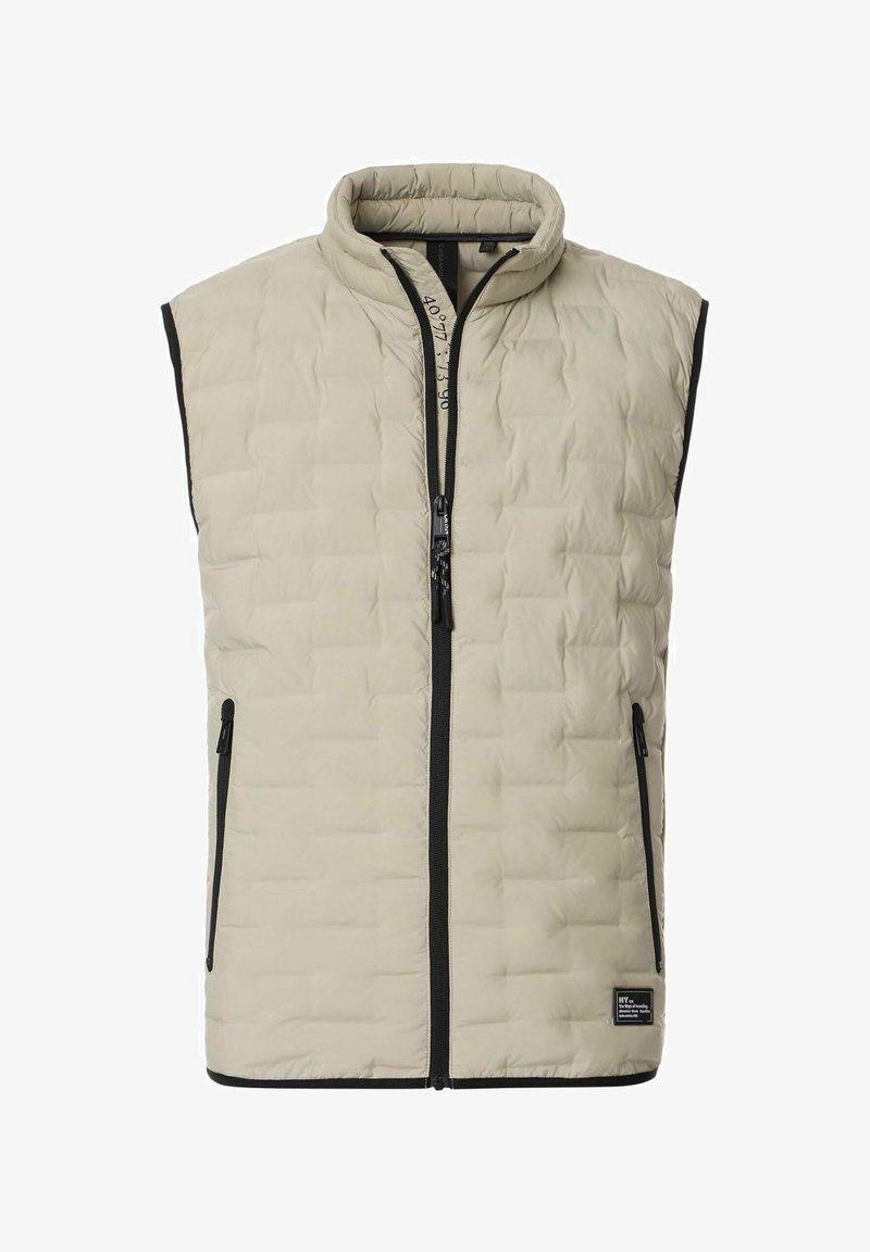 Beige gesteppte Weste mit hohem Kragen, Frontreißverschluss und schwarzen Akzenten. Verfügt über Seitentaschen und eine weiche, gepolsterte Textur.