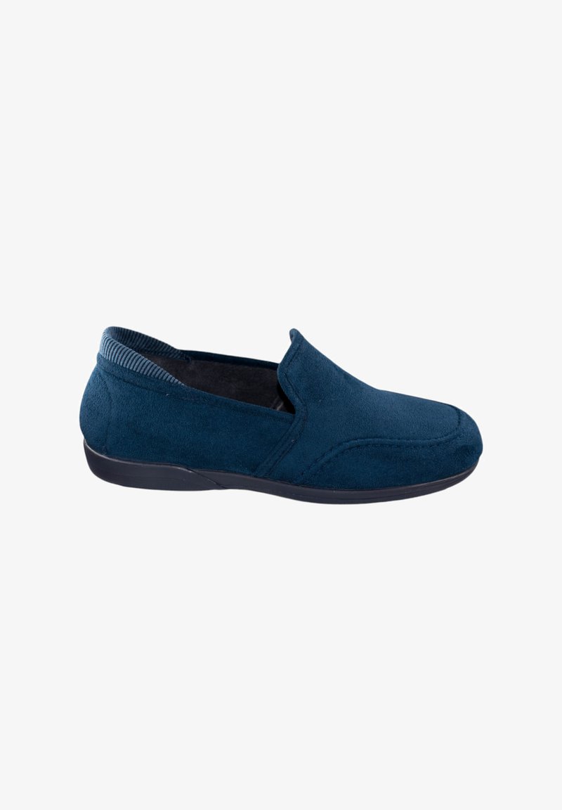 Zapato de ante azul marino para hombre, tipo slip-on, con suela de goma negra y un forro de cuello acanalado, mostrado en perfil lateral sobre un fondo blanco.