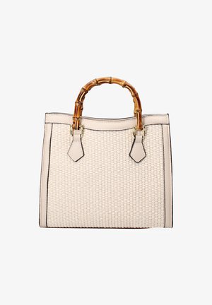 Woven beige handbag with bamboo handles, contrasting black trim, and decorative hardware details. Structured rectangular shape.