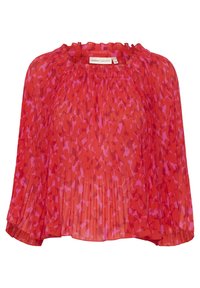 Blouse à motifs rouges et roses avec un design plissé, tissu doux et encolure à volants. Les manches amples créent une coupe fluide à l'ourlet.