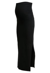 Jupe de maternité noire avec une taille repliable et une fente sur le côté, conçue pour s'adapter à un ventre de femme enceinte.