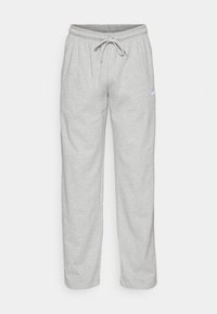 Grå sweatpants i mjukt tyg, med ett elastiskt midjeband med dragsko, sidofickor och en liten logotyp på vänster lår.